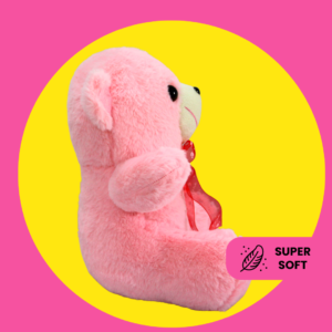 Cute pink teddy bear plush toy with a ribbon bow